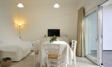 Apartment Cala Liberotto I | Bright living area with dining table Bright living area with dining table