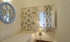 Casa 2 | Bedroom with two single beds, perfect for kids, one on each side of the patio Bedroom with 2 single beds