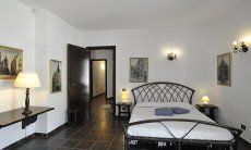 Villa Nautilus | Bedroom 3 with double sized bed, third beda and access to the garden Bedroom 3 with double sized bed