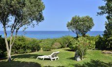 View across the wide garden towards the blue sea