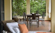 Villa Ulivi 12 | Covered terrace with dining table and lounge area Sardinia