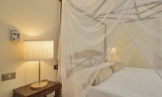 Villa Ulivi 12 | Bedroom 1 with double bed with canopy Bedroom