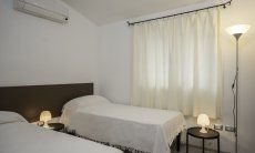 Villa Caterina | Bedroom 2 with two single beds Bedroom