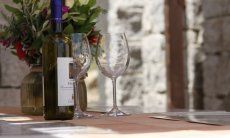 Li Conchi 29 | The terrace is perfect to have a glass of good sardinian wine Bottle of wine and two glasses