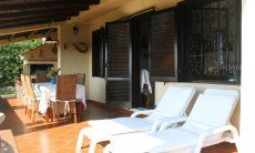 Villa Monica | Terrace with sunbeds and dining space Terrace with sunbeds and dining space