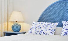 Villa Bella | Double bed in bedroom 1 Double bed with night table and lamp in light blue