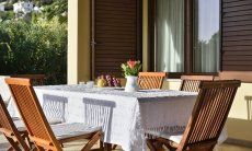 Dining outside with a garden view 