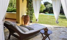 Villa Ulivi 12 | Lounger with table and view over the garden Relax