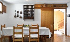 Dining area with a big table on the ground floor 