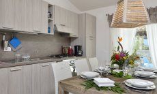 Villa Campidano 20 | Dining table with kitchenette Dining table and kitchenette of Villa Campidano 20