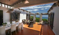Covered dining area with sea view 