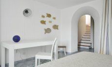 Li Conchi 16 | Bedroom 3 with desk and stairs leading to the first floor Bedroom, basement floor