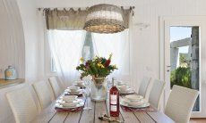 Li Conchi 14 | Beautifully set dining table with wicker lamp Dining room