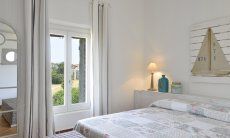 Li Conchi 14 | Bedroom 1 with double bed and door to the garden Bedroom