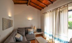 Villetta 12 | Sofa area with terrace access Sofa area with terrace access