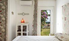 Li Conchi 8 | Bedroom 2 with garden access and double sized bed Bedroom with door to the garden