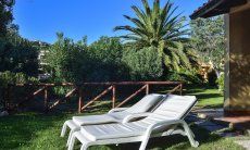 Villa Maria Lina | Garden view with sunbeds Garden view with sunbeds