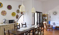 Villa Gaia | Living room with a long dining table Living room with a long dining table