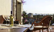 Li Conchi 7 | Perfect place to enjoy a glass of wine during beautiful sardinian sunsets White wine with two glasses on the terrace with sea view of Li Conchi 7