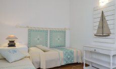 Li Conchi 7 | Bedroom 2 with two single beds and sardinian decoration Bedroom with two single beds Li Conchi 7