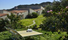 Li Conchi 7 | relaxing on the sunbeds with a beautiful view of the nature Garden with two sun loungers in front of the holiday home Li Conchi 7