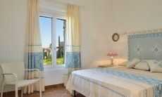 Li Conchi 9 | Bedroom 1 with double bed and garden view Bedroom with double bed and fabrics decorated in sardinian style Li Conchi 9, Cala Sinzias