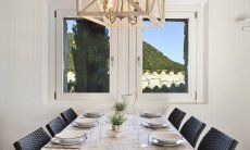 Li Conchi 10 | Practical dining table Dining Table on the window with view Li Conchi 10, Cala Sinzias
