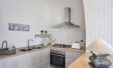 Li Conchi 10 | Stylish kitchen with stove, oven, hood and sink Kitchen Li Conchi 10, Cala Sinzias