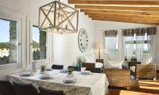 Li Conchi 10 | Living room with dining table, sofa corner and panoramic window Living Room Li Conchi 10, Cala Sinzias