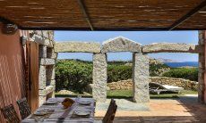 Villa Domus 9d | Roofed terrace with dining table Roofed terrace with dining table