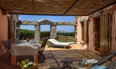 Villa Domus 9d | Terrace with dining area and the sea in the background Terrace with dining area and the sea in the background