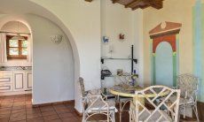Villa Domus 9d | Living room with a table and view towards the kitchen Living room with a table and view towards the kitchen
