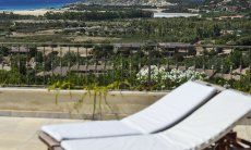 View from the sunbeds of Torretta Chia over the landscape all the way to the beach of Chia