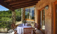 Villa Torretta Chia | Dining area outside with sea view Dining area outside