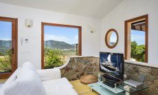 Villa Torretta Chia | Bright living area with a stunning view Bright living area with a stunning view