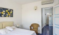 Villa Torretta Chia | Bedroom 1 with double sized bed and view towards the corridor has a private bath Bedroom 2 with double sized bed and view towards the corridor