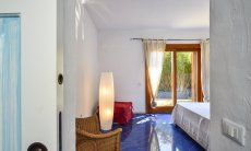 Villa Torretta Chia | Bedroom 3 with double sized bed and garden access Bedroom 3 with double sized bed and garden access