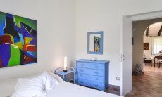 Villa La Viola | Bedroom 1 with a view towards the hall Bedroom 1 with a view towards the hallway
