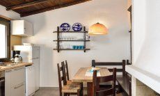 Apartment Nido 1 | Kitchenette with dining area and fire place After Restauration 2017