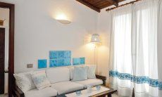 Apartment Nido 1 | Sofa and matching sardinian curtains Sofa
