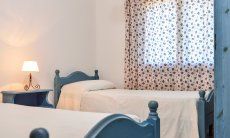 Villa Le Ginestre 1 | Bedroom 1 upstairs with two single beds Bedroom 1 upstairs with two single beds