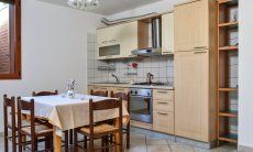 Villa Le Ginestre 1 | Kitchen souterrain with dining table Kitchen souterrain with dining table