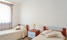 Villa Le Ginestre 2 | Bedroom 2 upstairs with two single beds Bedroom 2 upstairs with two single beds