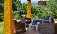 Roofed terrace with a garden view 