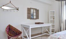 A writing desk in bedroom 1 