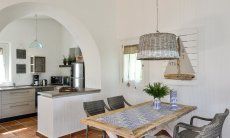 Li Conchi 4 | Dining table and kitchen in the background Dining table with kitchen in the background