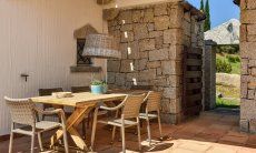 Li Conchi 5 | Covered dining area on the terrace Dining table on the terrace of the holiday home Li Conchi 5