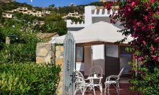 Villa Chiara | Entrance with terrace and coffee table Pavillon with a coffee table