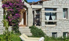 Li Conchi 15 | House in granite with blooming bougainvillea View of the House