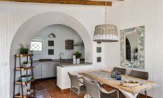 Dining area with kitchen in the background